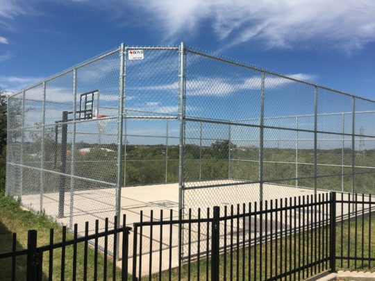 Boyd Fence & Welding installs chain link fence in Abilene, Texas.